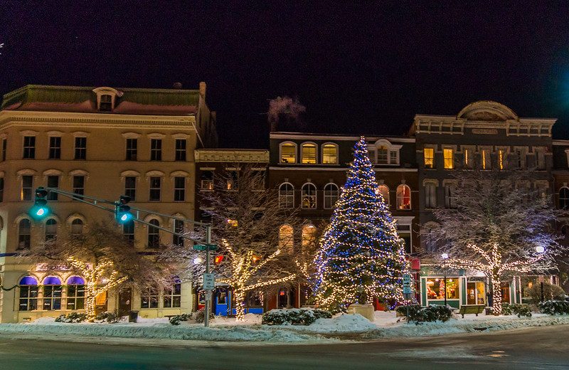 photo of downtown bangor buildings at night at christmas with a large christmas tree